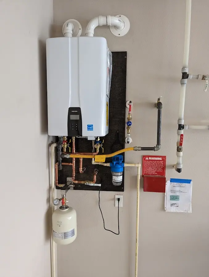 Professional plumber installing copper piping in a Big Bear City home